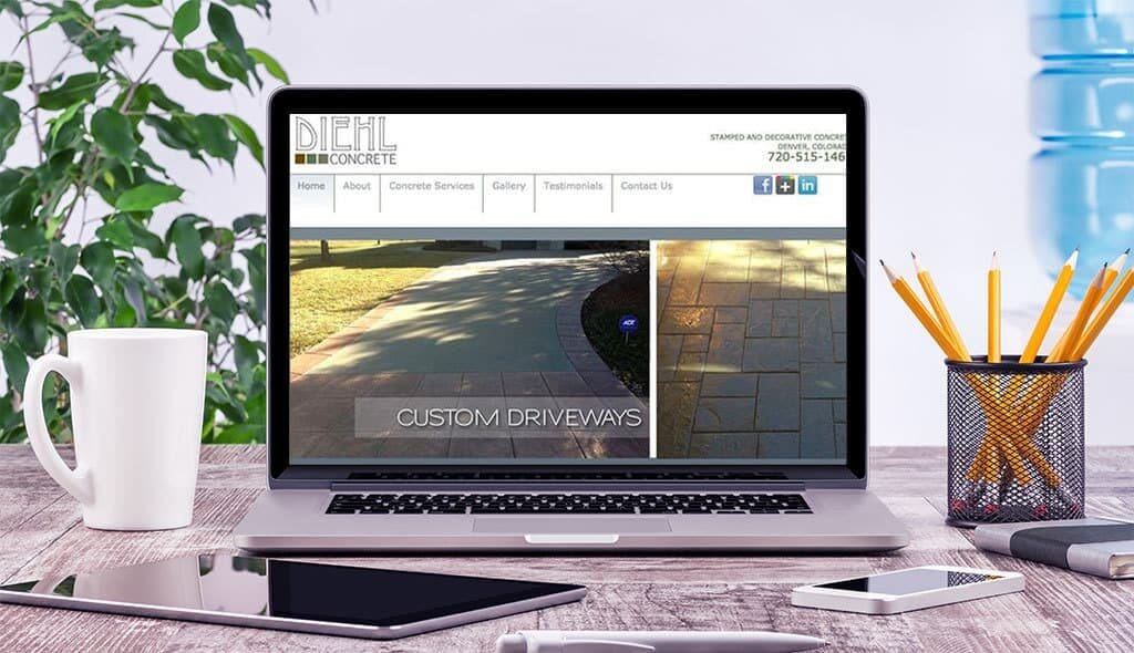 laptop displaying the home page of Diehl Custom Concrete