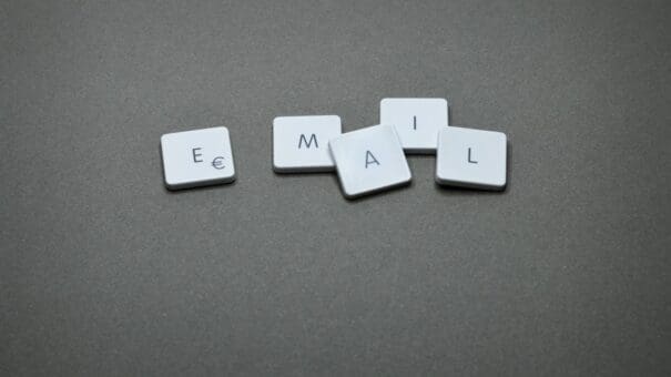 scrabble letters that have a separated e from the mail representing why separate web hosting and email is a must