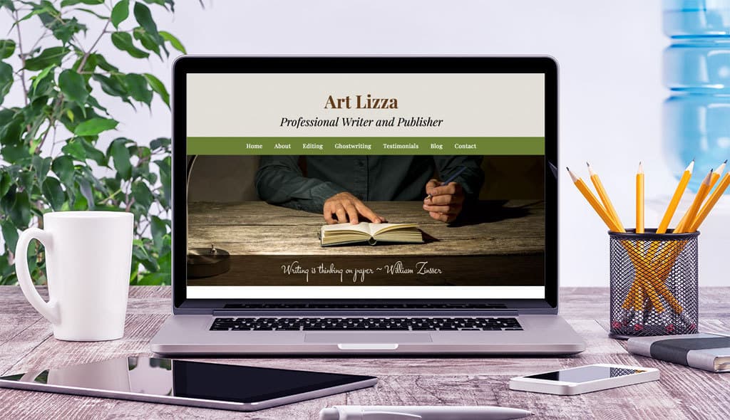 laptop displaying the home page of Art Lizza