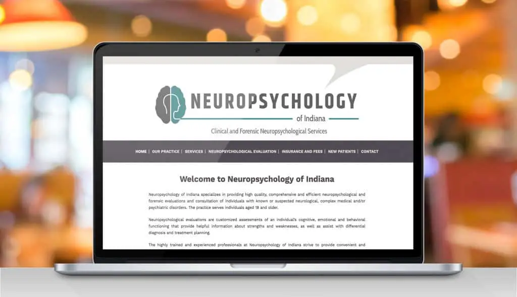 laptop displaying the home page of Neuropsychology of Indiana