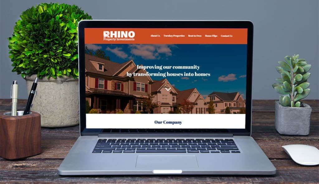 laptop displaying the home page of Rhino Property Investments