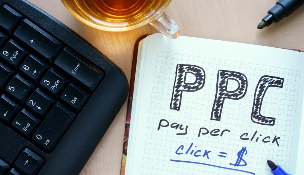 Notepad with words PPC pay per click concept and marker. Online Ad Campaigns