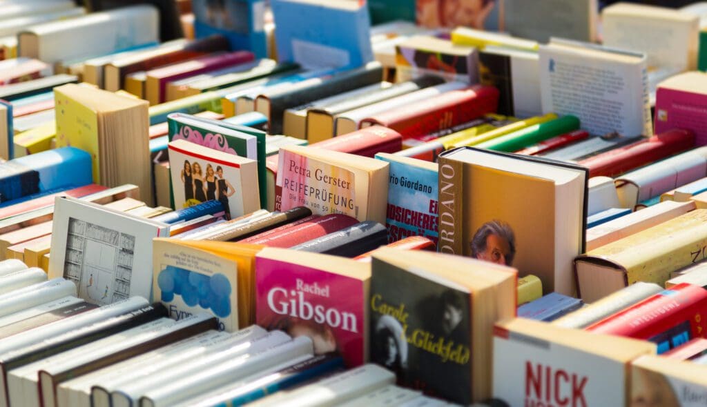Full Frame Shot Of Books For Sale Full Frame Shot Of Books For Sale