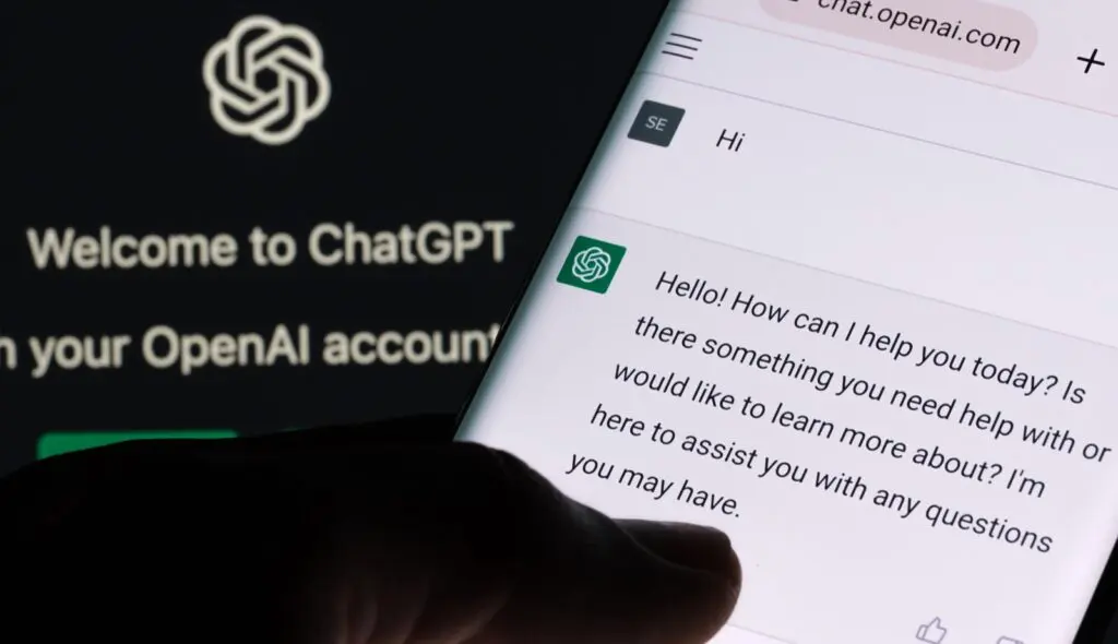 ChatGPT chat bot screen seen on smartphone and laptop display with Chat GPT login screen on the background. A new AI chatbot by OpenAI. Stafford, United Kingdom, December 13, 2022. Using ChatGPT for business