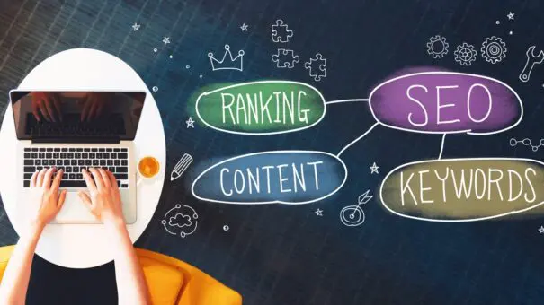 SEO concept with person using a laptop SEO concept with person using a laptop to represent an SEO cheatsheet
