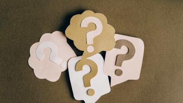 Cut out question marks representing web design questions