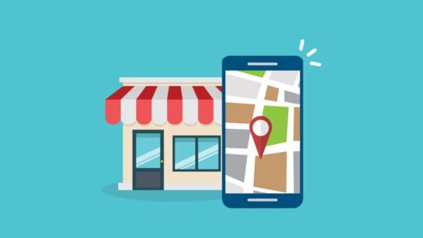 cellphone in front of local business | when you optimize for local search, you will get more customers to your brick and mortar store