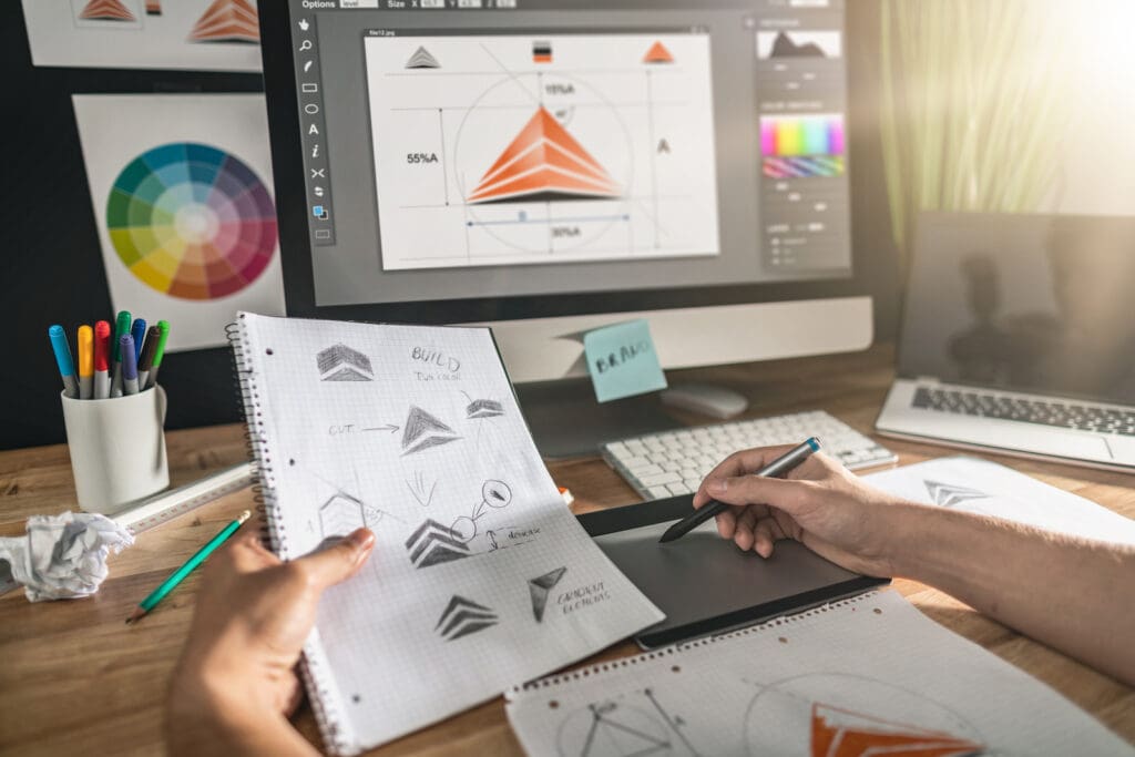 Designer creating vector logo