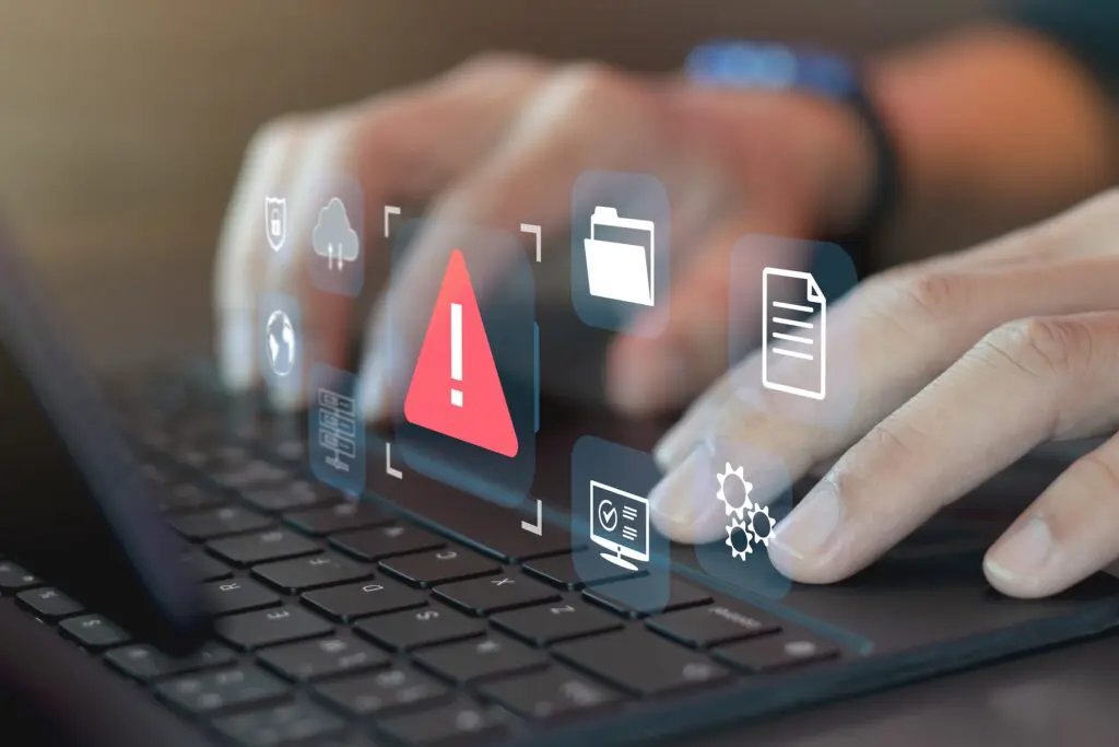 Fingers on keyboard, with icons showing errors and issues