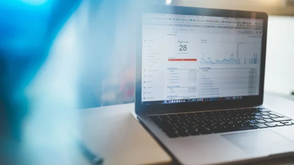 Google Analytics data shown on a laptop.