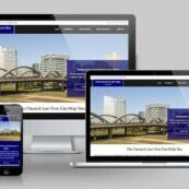desktop, laptop, & cell phone displaying the homepage of Claunch Law