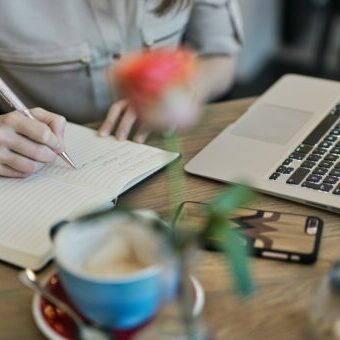 content-creation-worksheet Person writing in notebook using our content creation worksheet