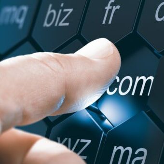 Registrar, Domain Name Registration. Man selecting a domain extention by pressing an hexagonal button. Composite image between a hand photography and a 3D background.