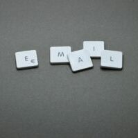 scrabble letters that have a separated e from the mail representing why separate web hosting and email is a must