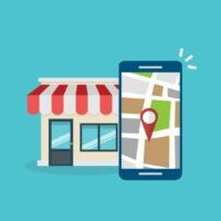 cellphone in front of local business | when you optimize for local search, you will get more customers to your brick and mortar store