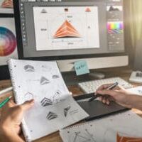 Designer creating vector logo