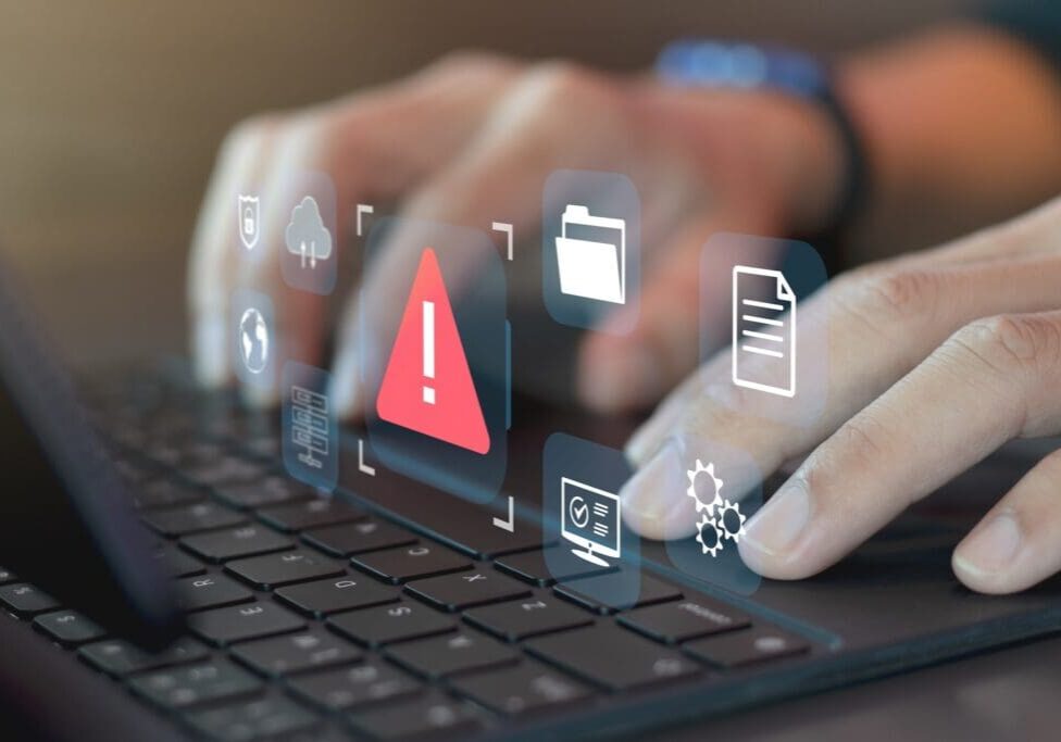 Fingers on keyboard, with icons showing errors and issues searching for how to prevent losing your website