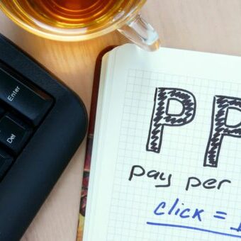 Notepad with words PPC pay per click concept and marker. Online Ad Campaigns