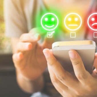 Customer Service Experience and Business Satisfaction Survey. Woman choose face smile on smart phone Online Surveys