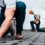 A roofer nailing a shingle to represent roofing website design