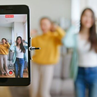 Girls making a TikTok video after learning how can TikTok help your business. Girls making a TikTok video after learning how can TikTok help your business