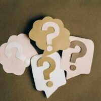 Cut out question marks representing web design questions